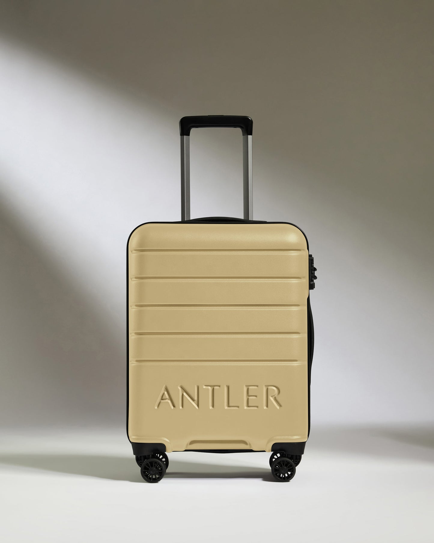 Suitcase Set in Dark Sand - Logo