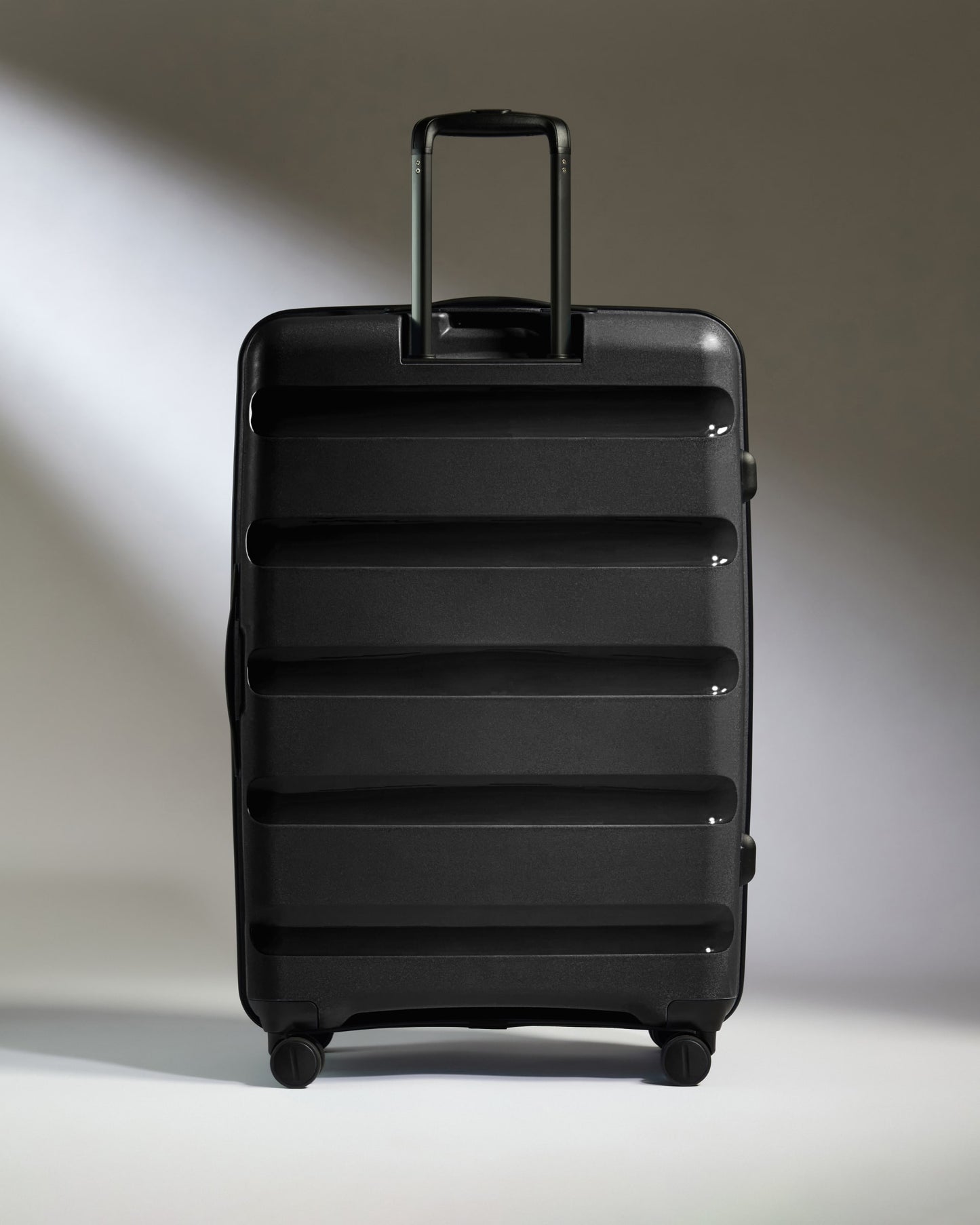 Large Suitcase in Black - Logo Stripe