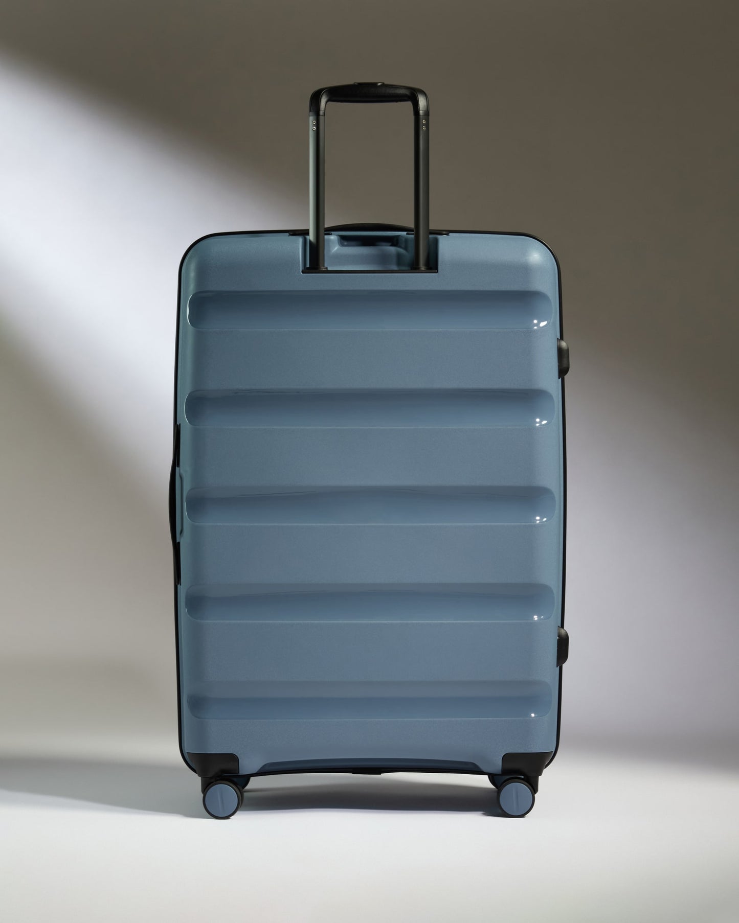 Large Suitcase in Light Blue - Logo Stripe