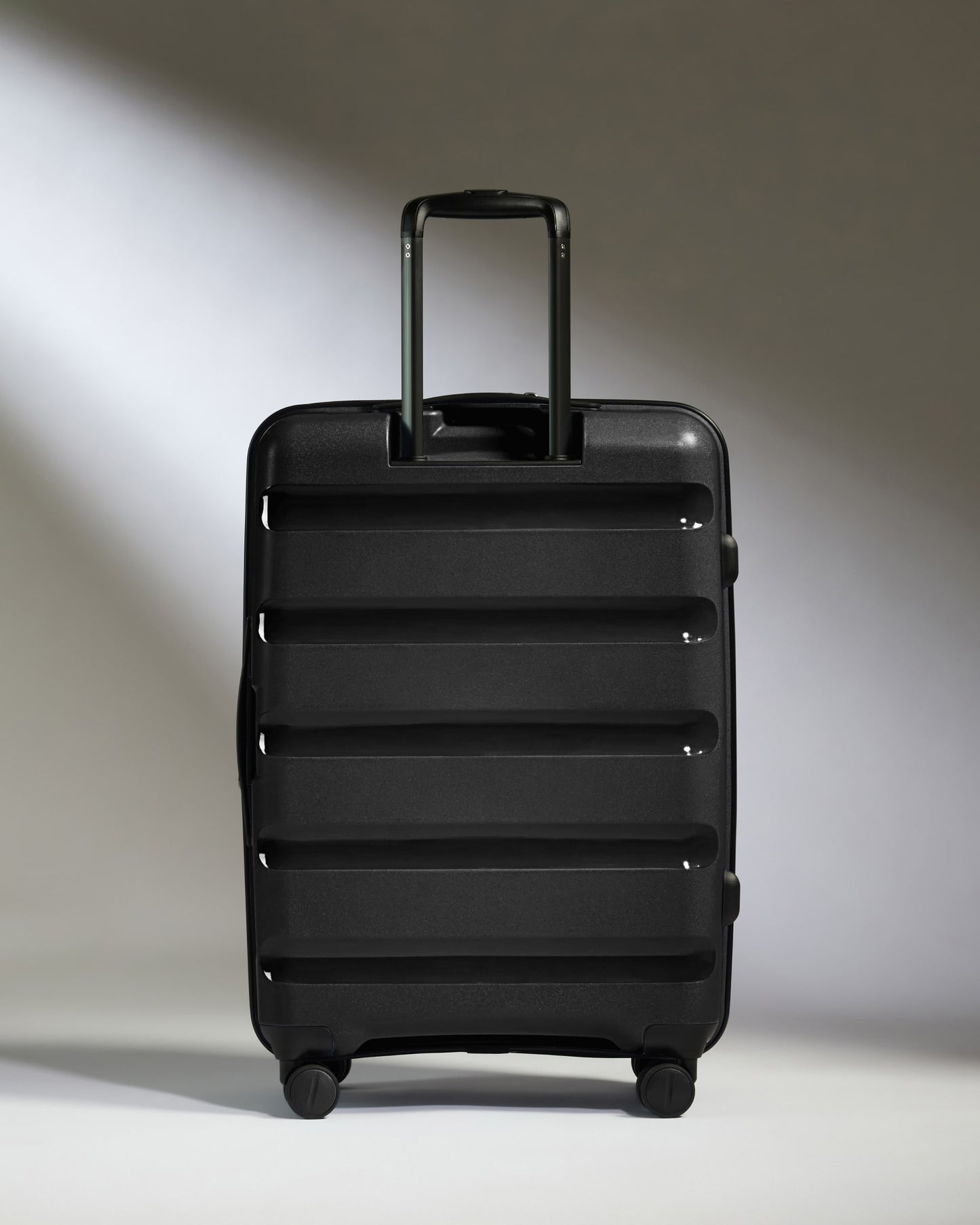 Medium Suitcase in Black - Logo Stripe
