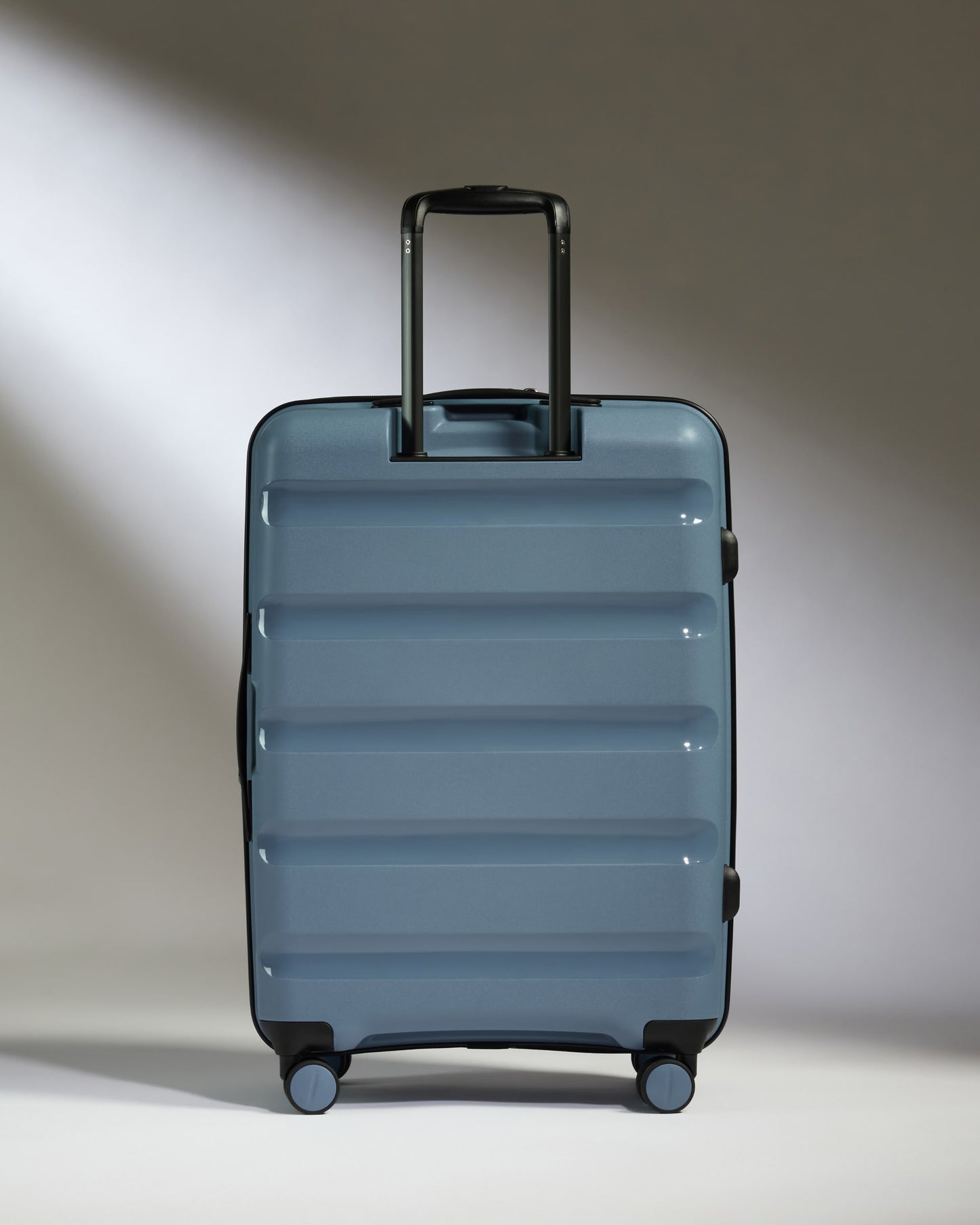 Medium Suitcase in Light Blue - Logo Stripe