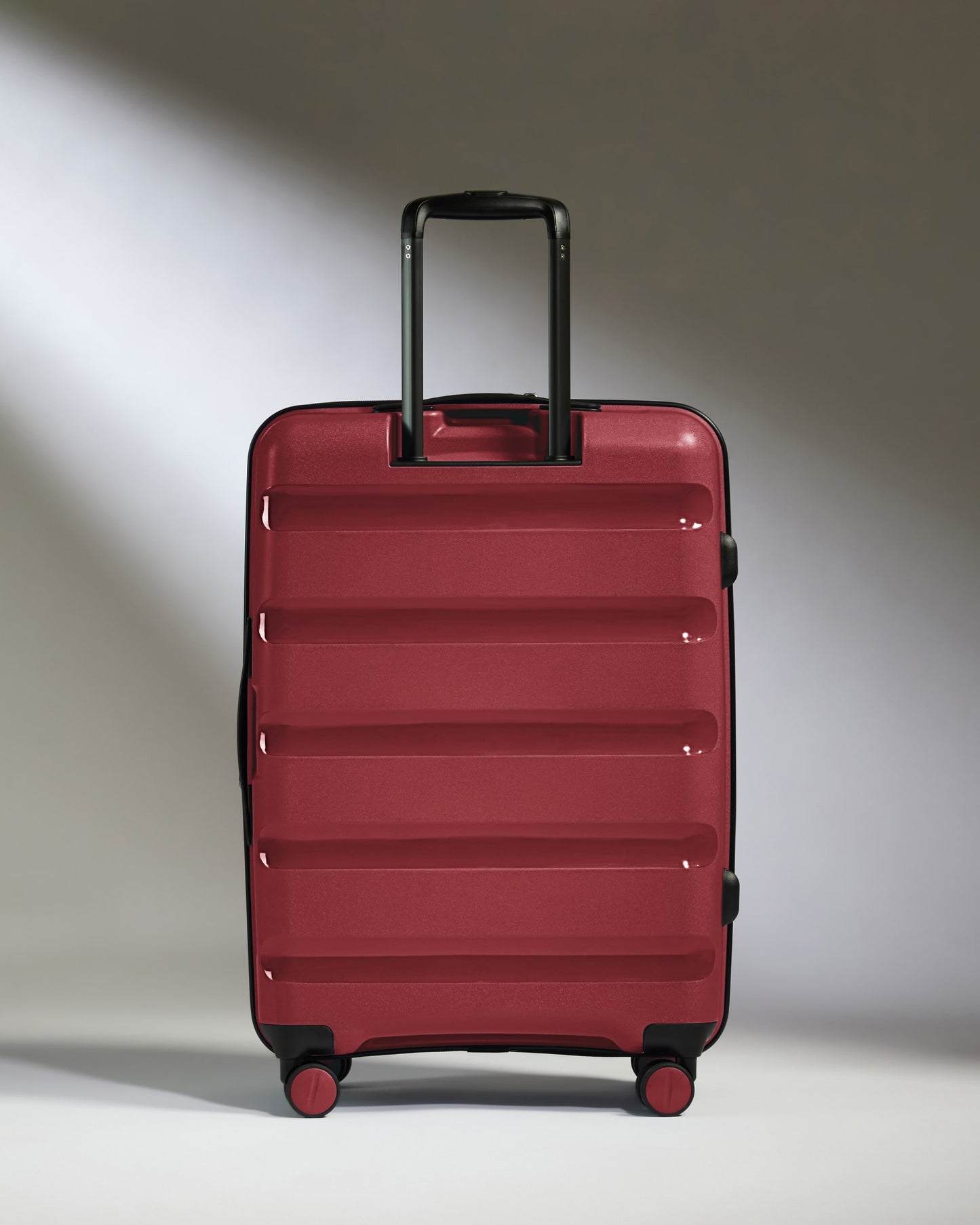Medium Suitcase in Soft Red - Logo Stripe