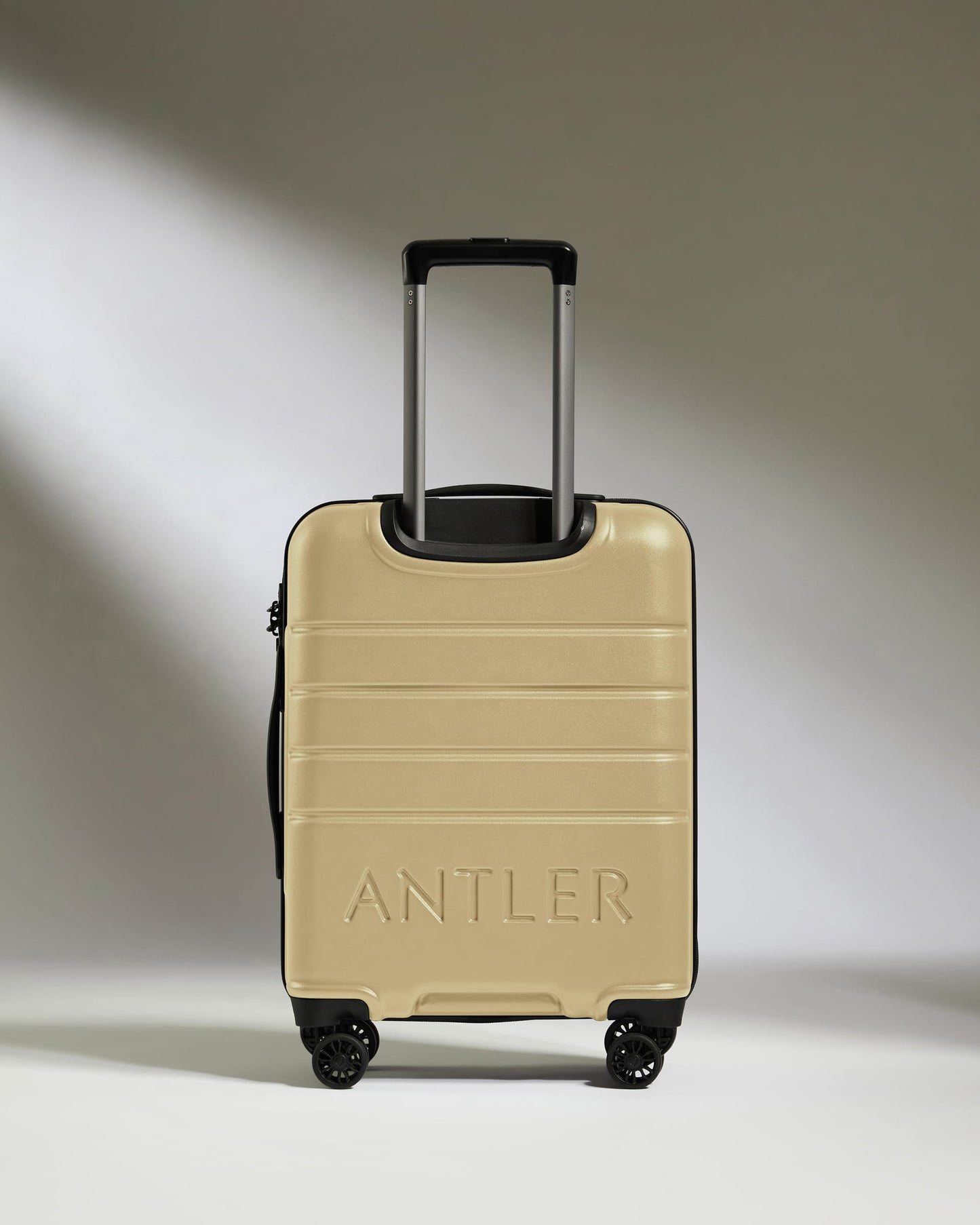 Cabin Suitcase in Dark Sand - Logo