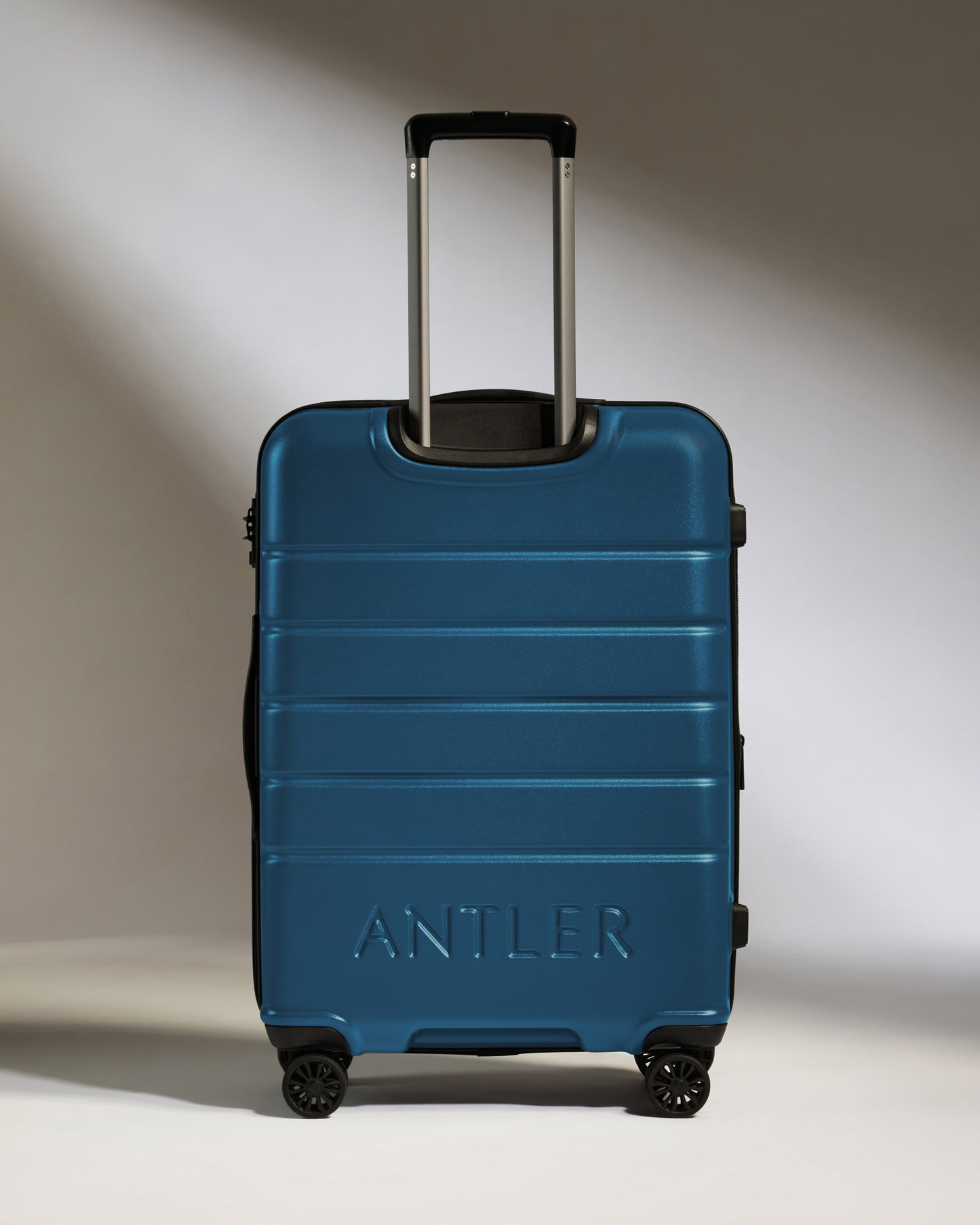 Medium Suitcase in Bold Blue - Logo