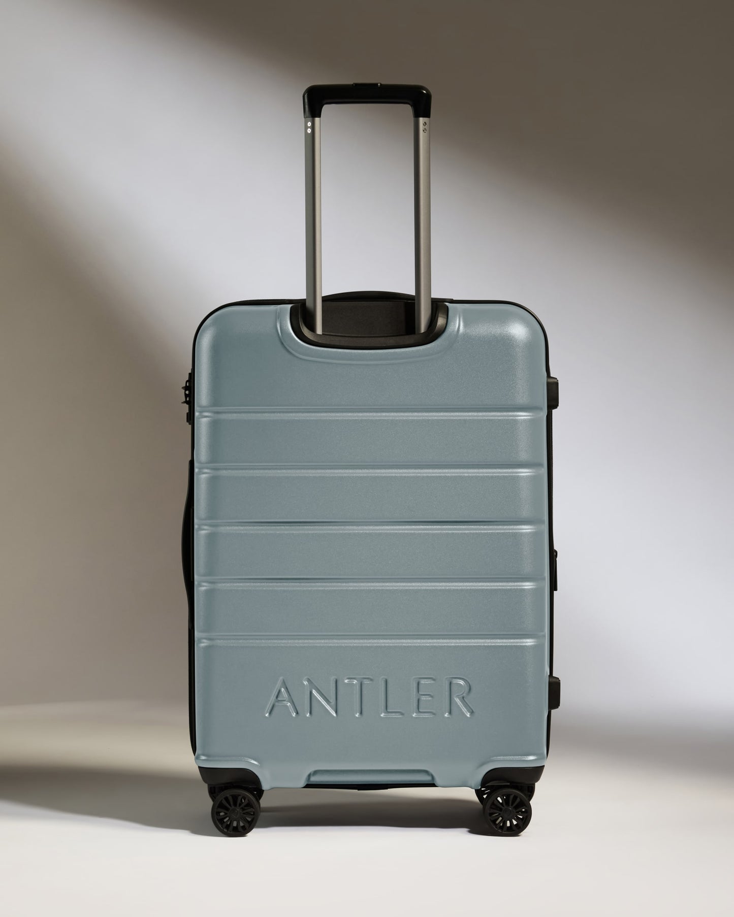 Medium Suitcase in Cool Grey - Logo