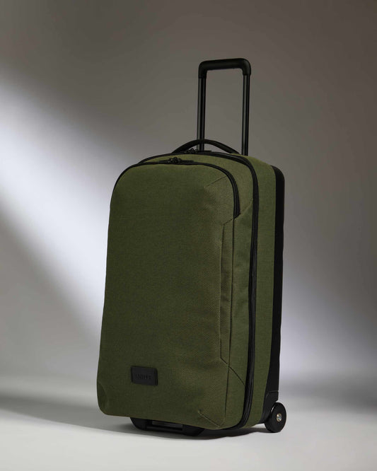 a green suitcase with wheels