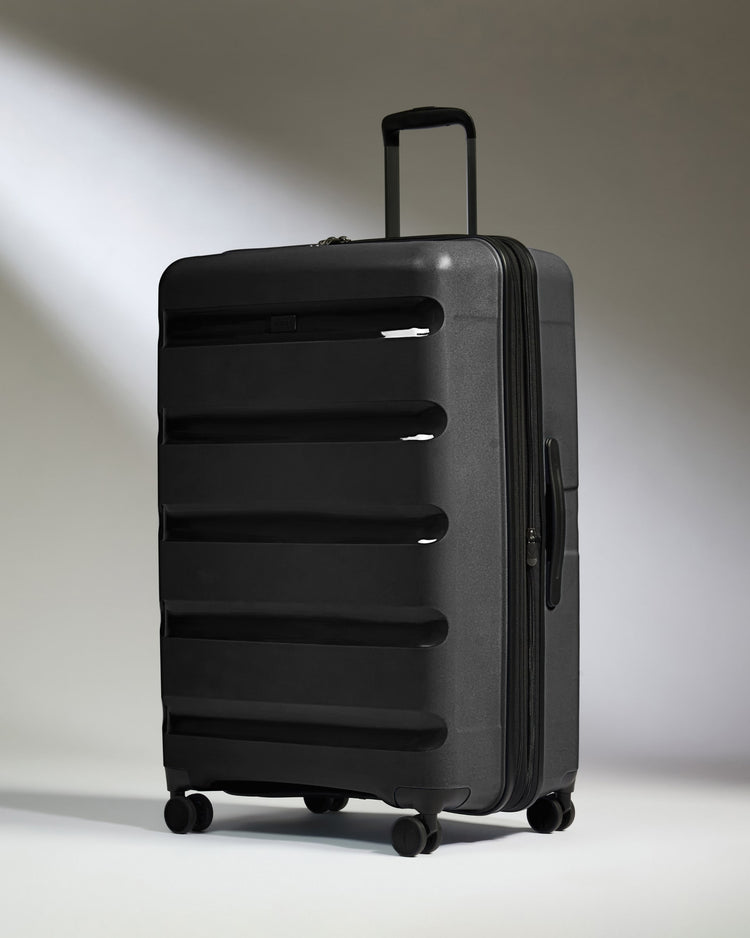 Large Suitcase in Black - Logo Stripe