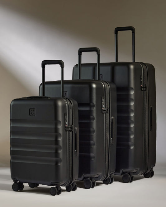 a group of black luggage