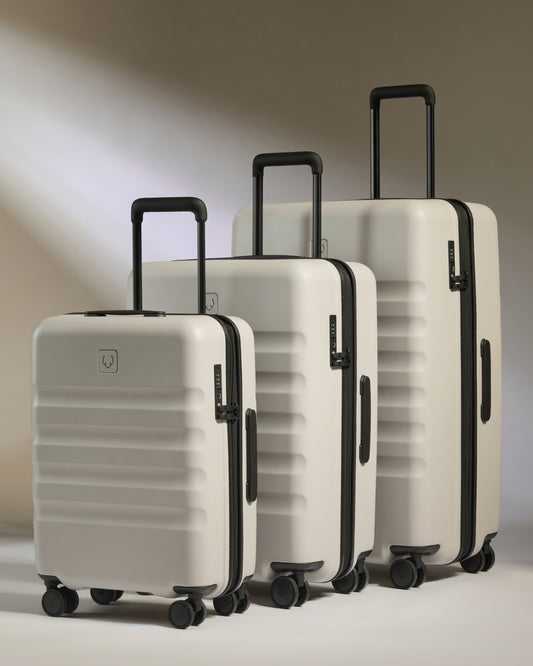 a group of luggage on wheels