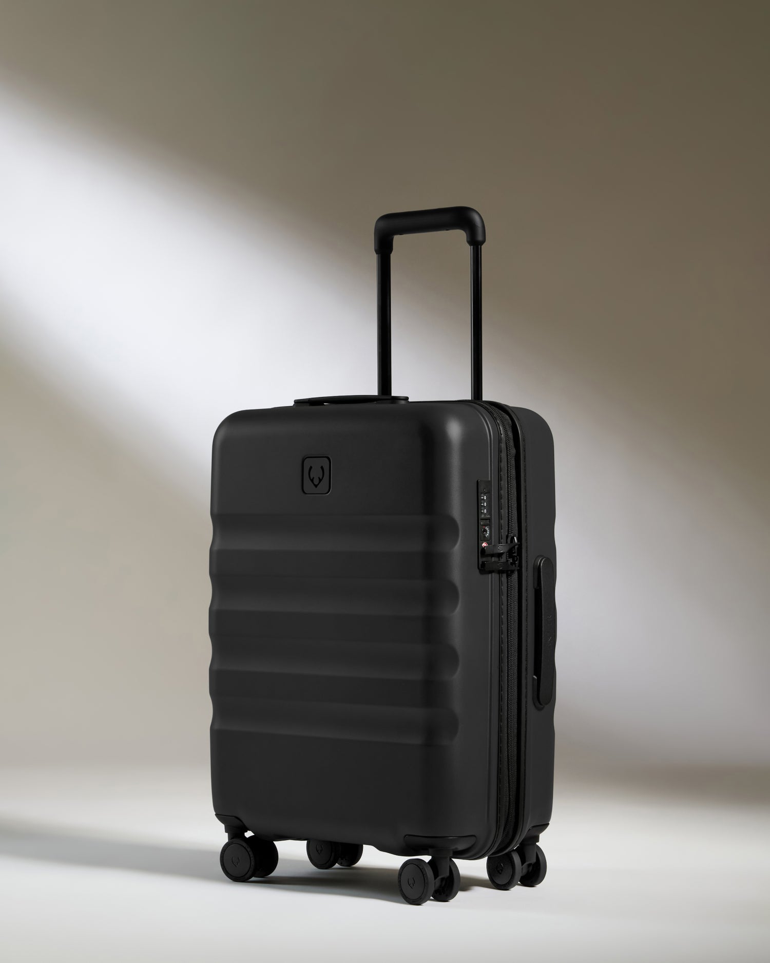 Cabin Suitcase in Black - Icon Stripe