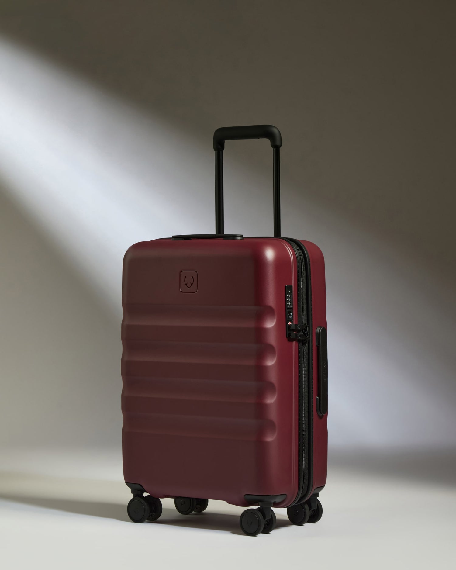 Cabin Suitcase in Cedar Red - Icon Stripe