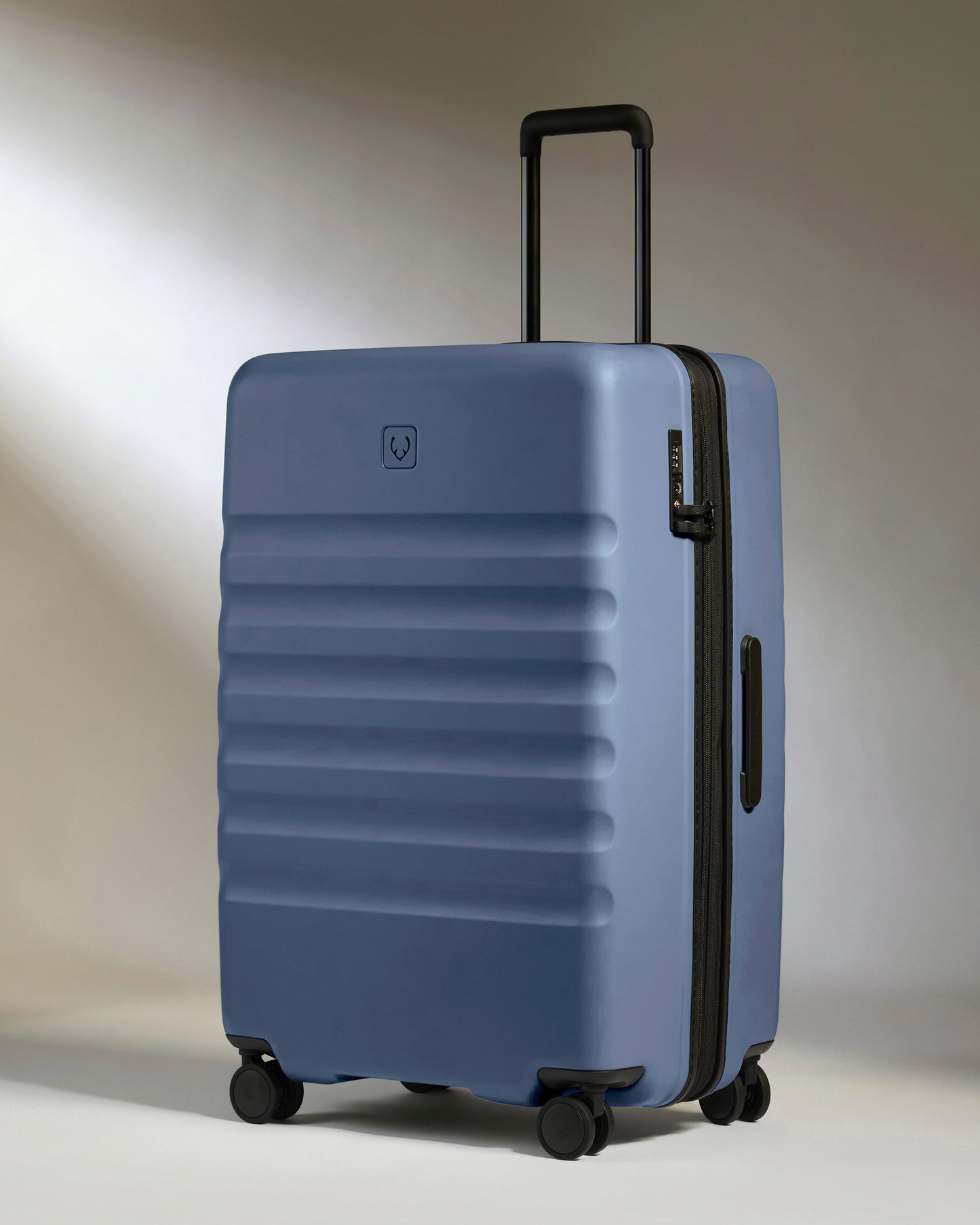 Large Suitcase in Ocean Blue - Icon Stripe