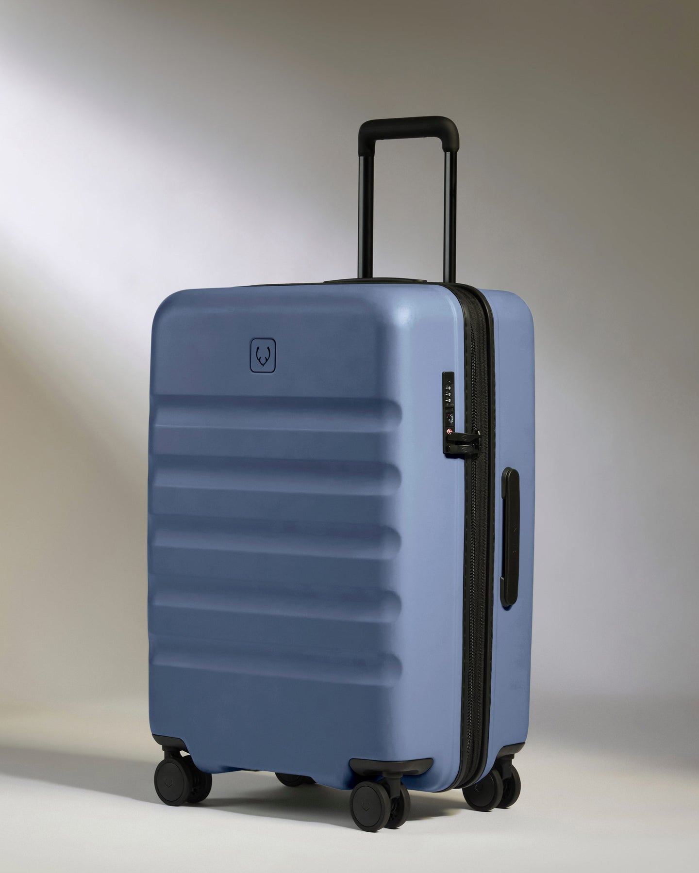 Medium Suitcase in Ocean Blue - Icon Stripe