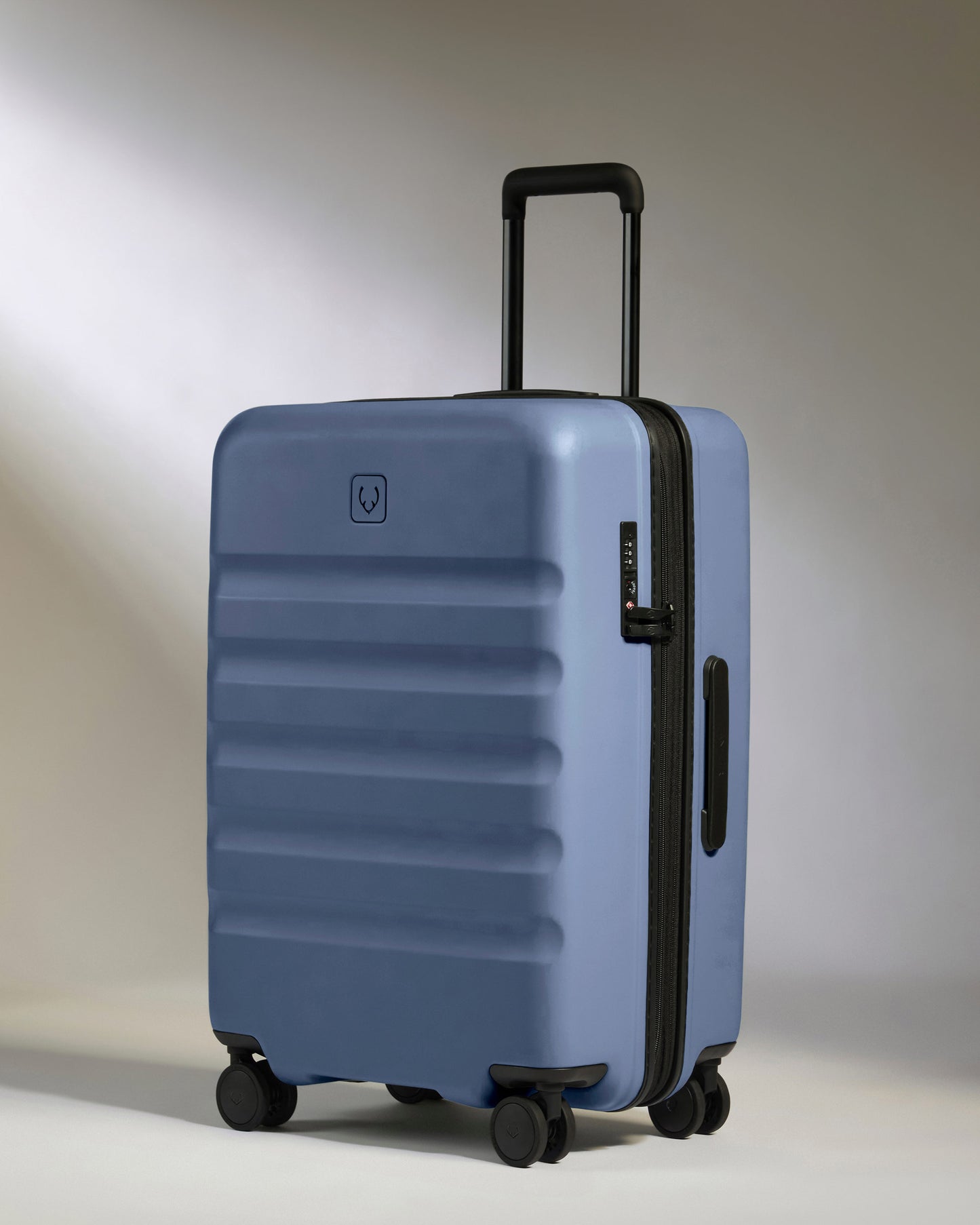 Medium Suitcase in Ocean Blue - Icon Stripe