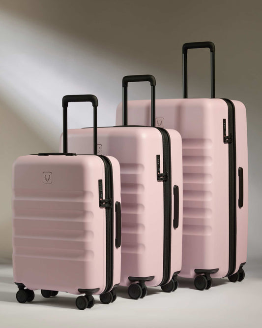 a group of pink luggage
