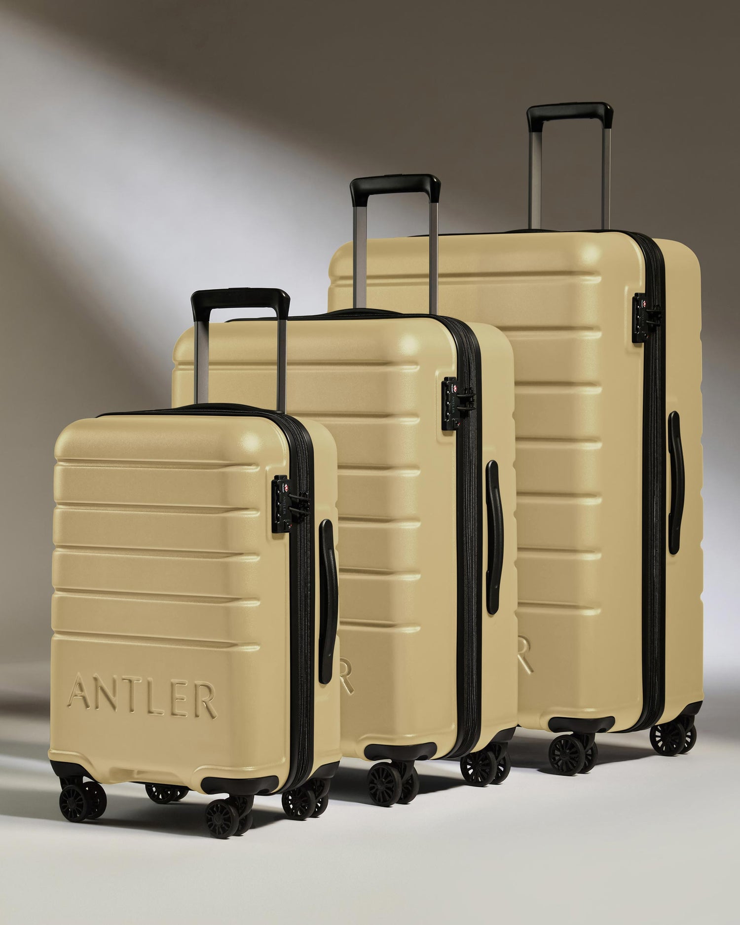 Expandable Suitcase Set in Dark Sand - Logo