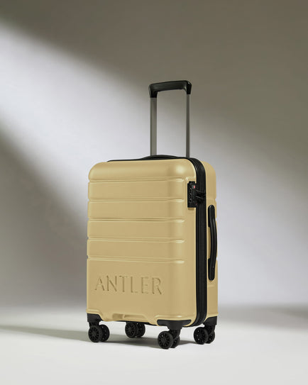 Cabin Suitcase in Dark Sand - Logo