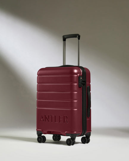 a red suitcase with wheels