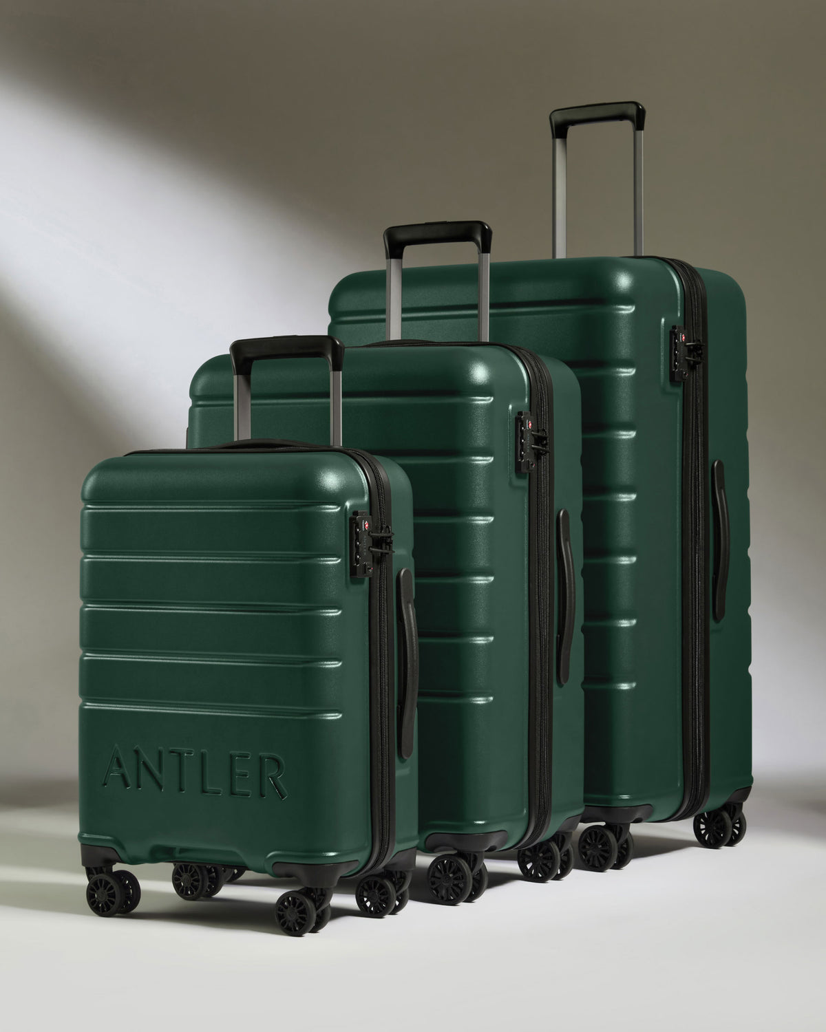 a group of luggage on wheels