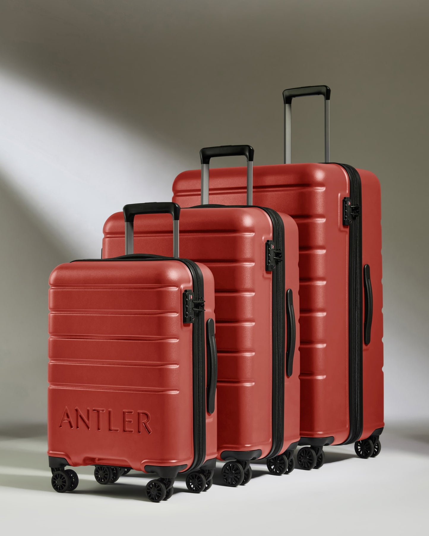 Suitcase Set in Red Orange - Logo