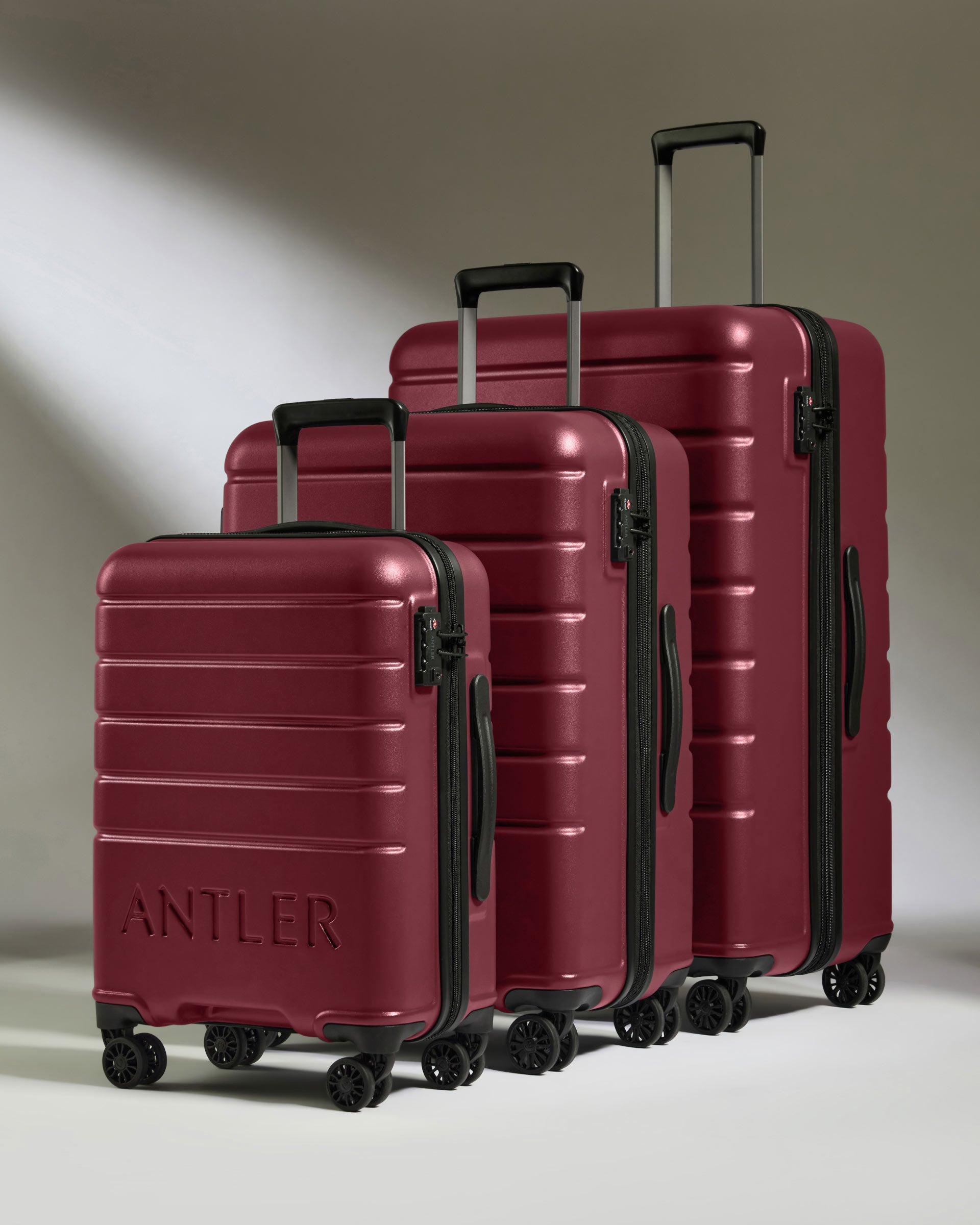 a group of luggage on wheels