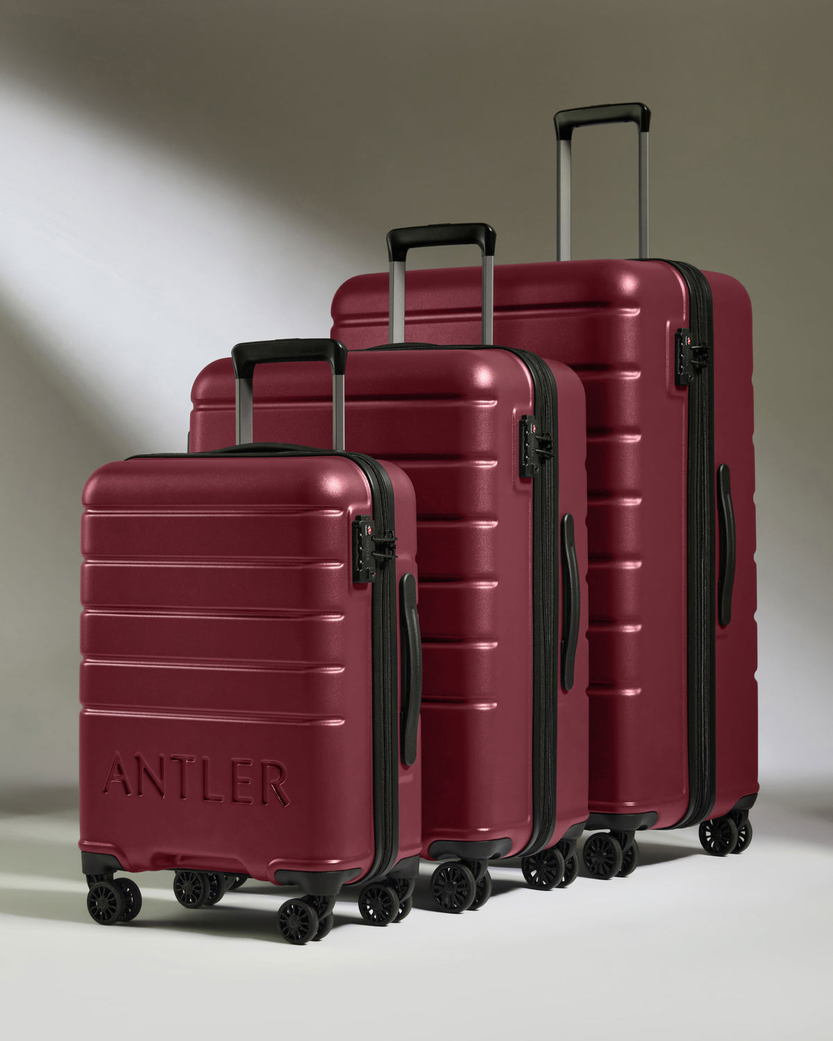 a group of luggage on wheels