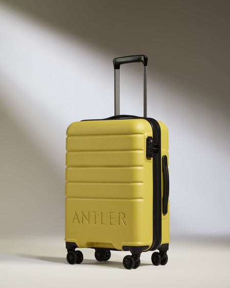 Cabin Suitcase in Mustard Yellow - Logo