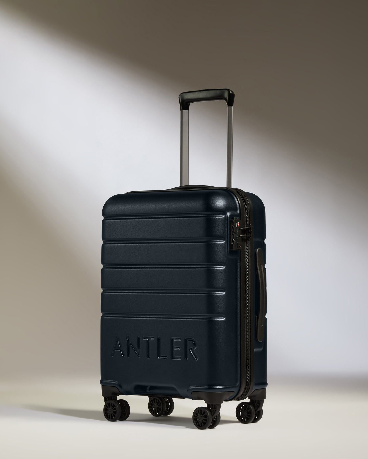 Cabin Suitcase in Dark Navy - Logo