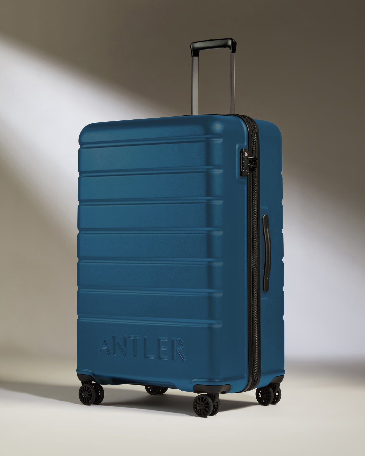 Large Suitcase in Bold Blue - Logo
