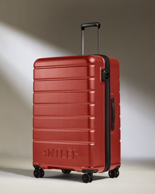 Large Suitcase in Red Orange - Logo