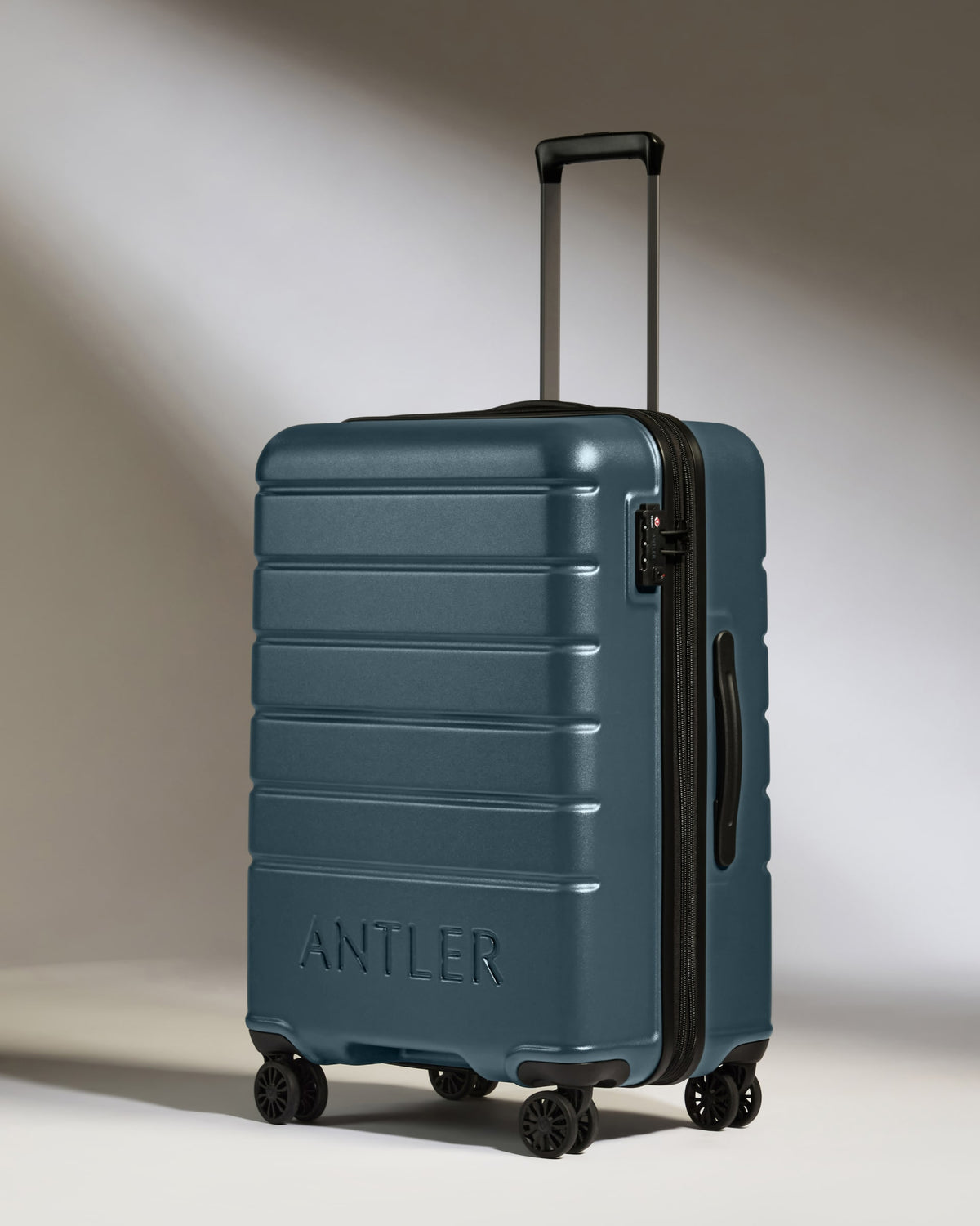 a blue suitcase with wheels