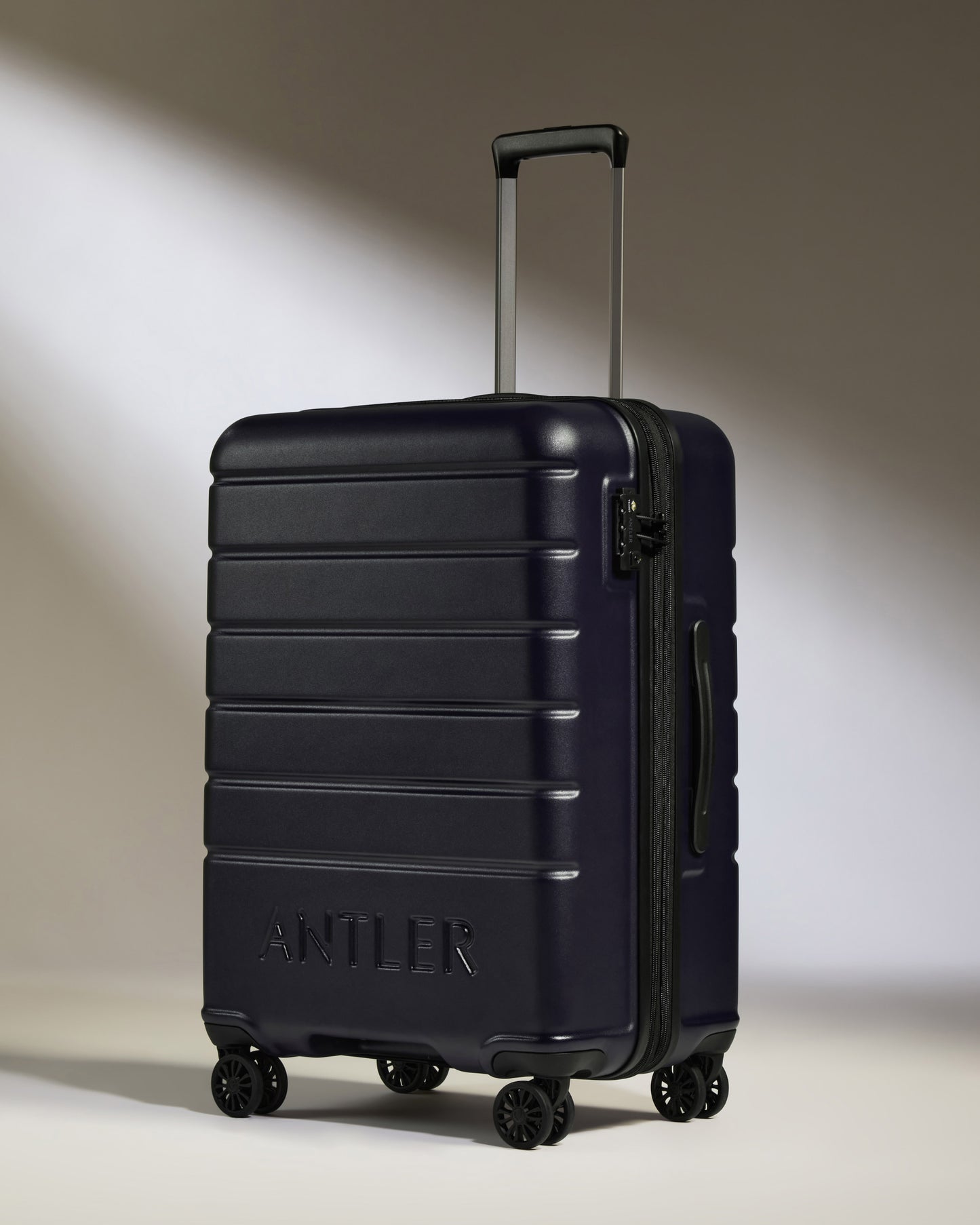 Medium Suitcase in Dark Purple - Logo