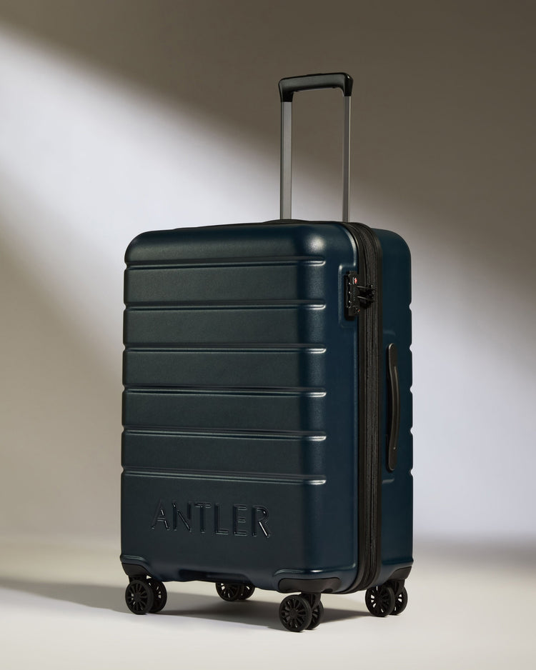 a blue suitcase with wheels