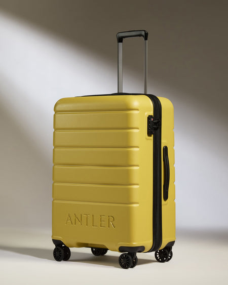 Medium Suitcase in Mustard Yellow - Logo