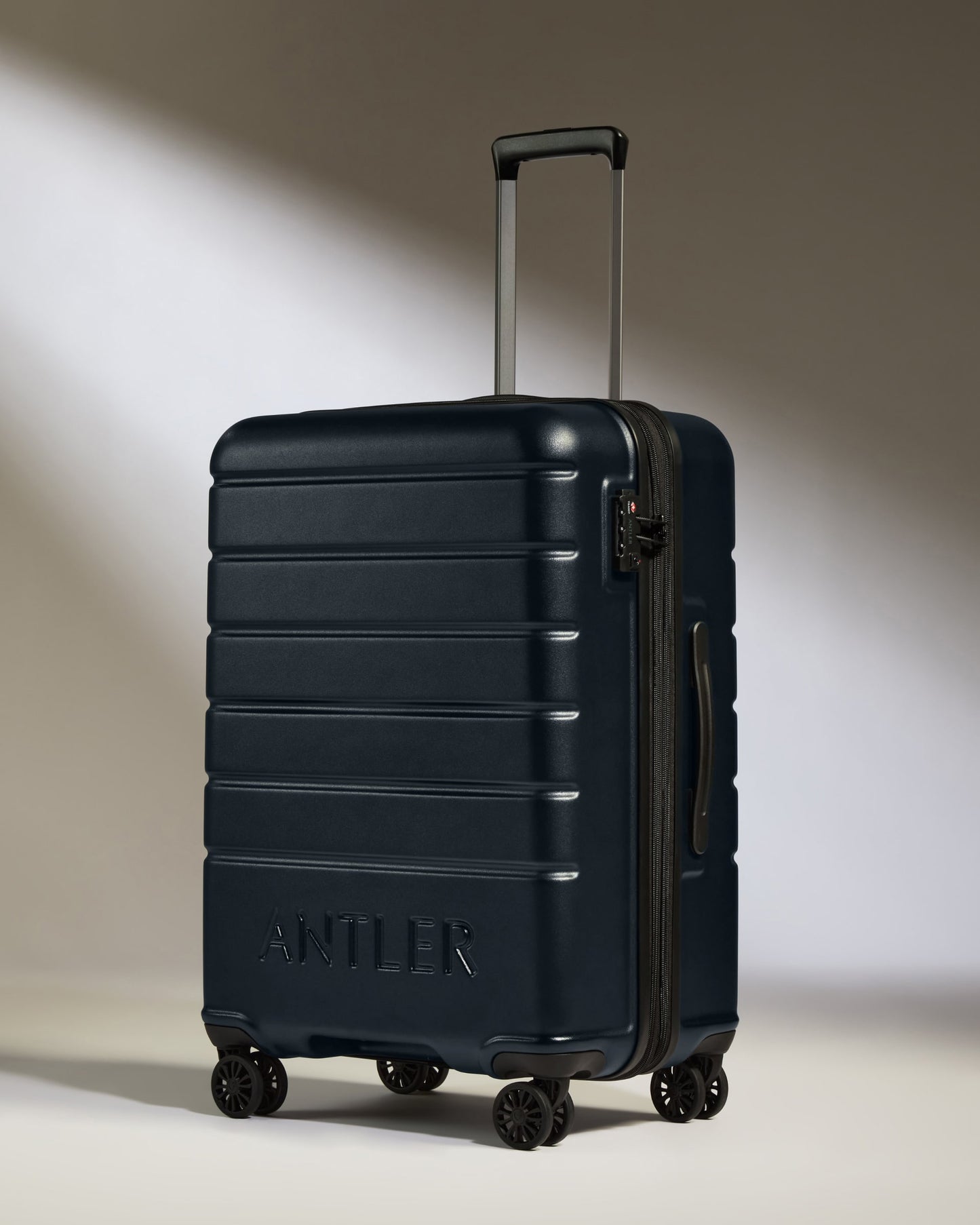 Medium Suitcase in Dark Navy - Logo