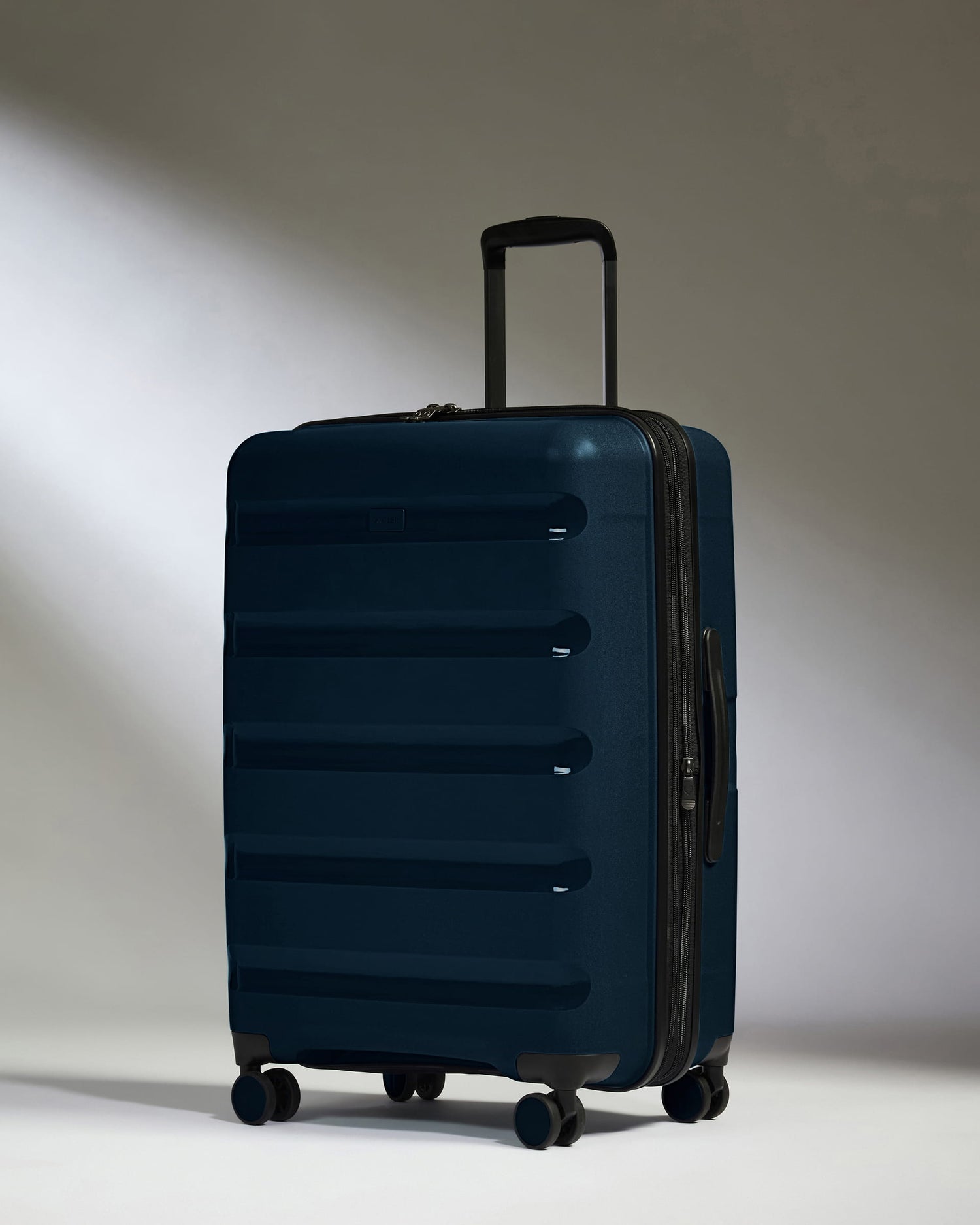 Medium Suitcase in Midnight Blue - Logo Stripe