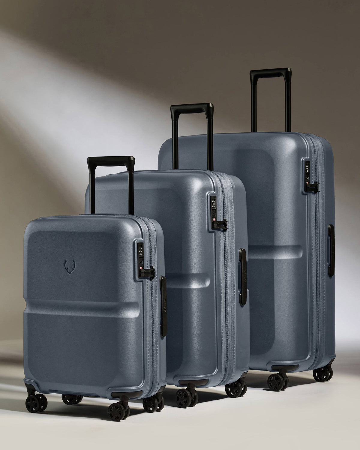 a group of luggage on wheels