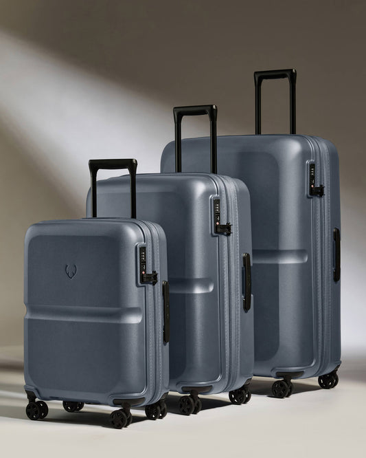 a group of luggage on wheels