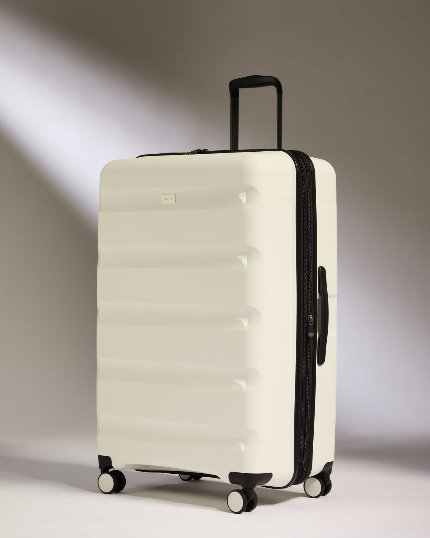 Large Suitcase in White - Logo Stripe