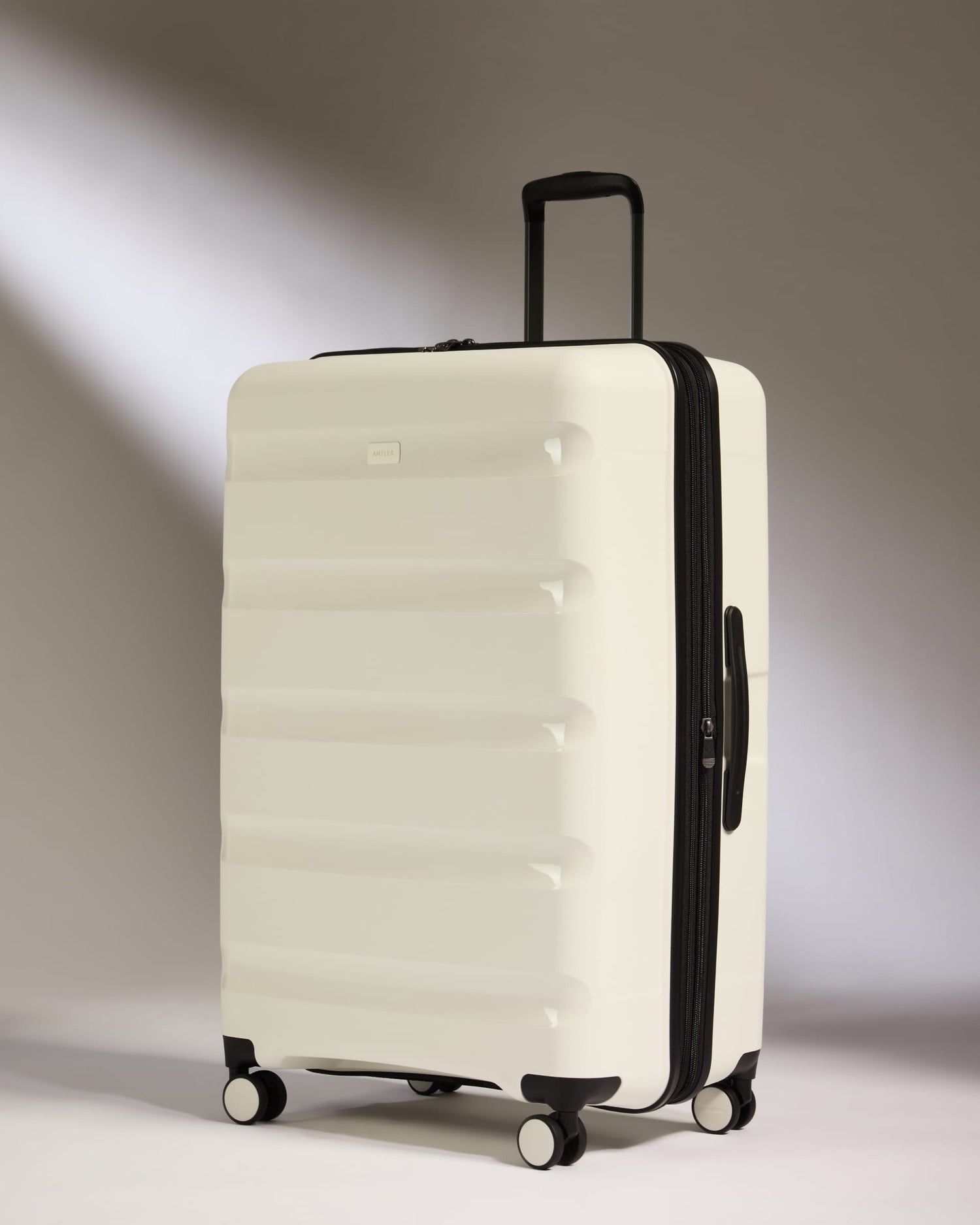 Large Suitcase in White - Logo Stripe