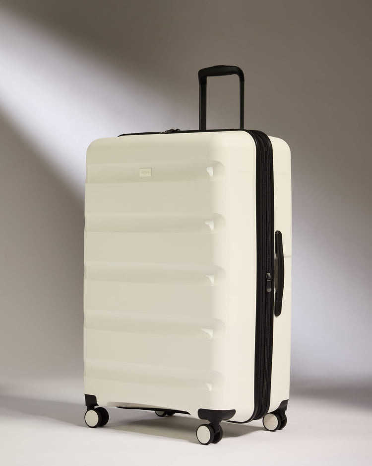 Large Suitcase in White - Logo Stripe