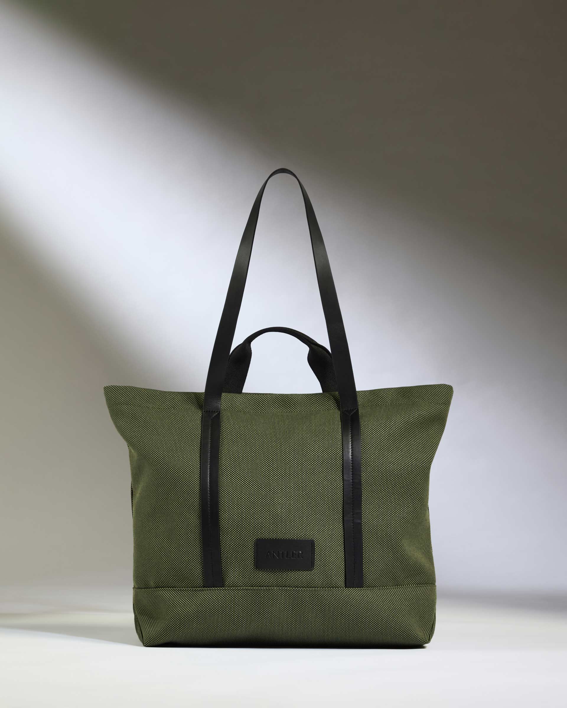 a green and black striped bag