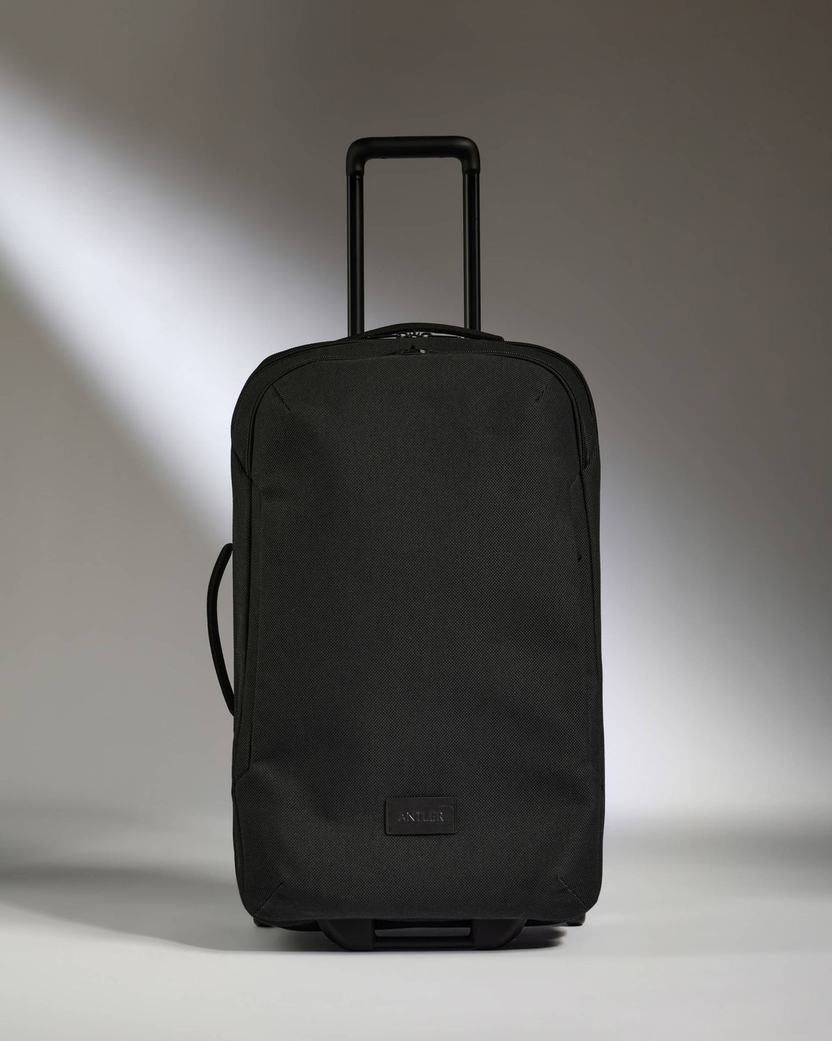 a black suitcase with handle