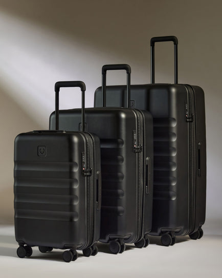 a group of black luggage