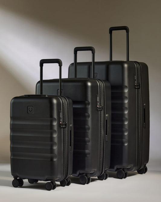 a group of black luggage