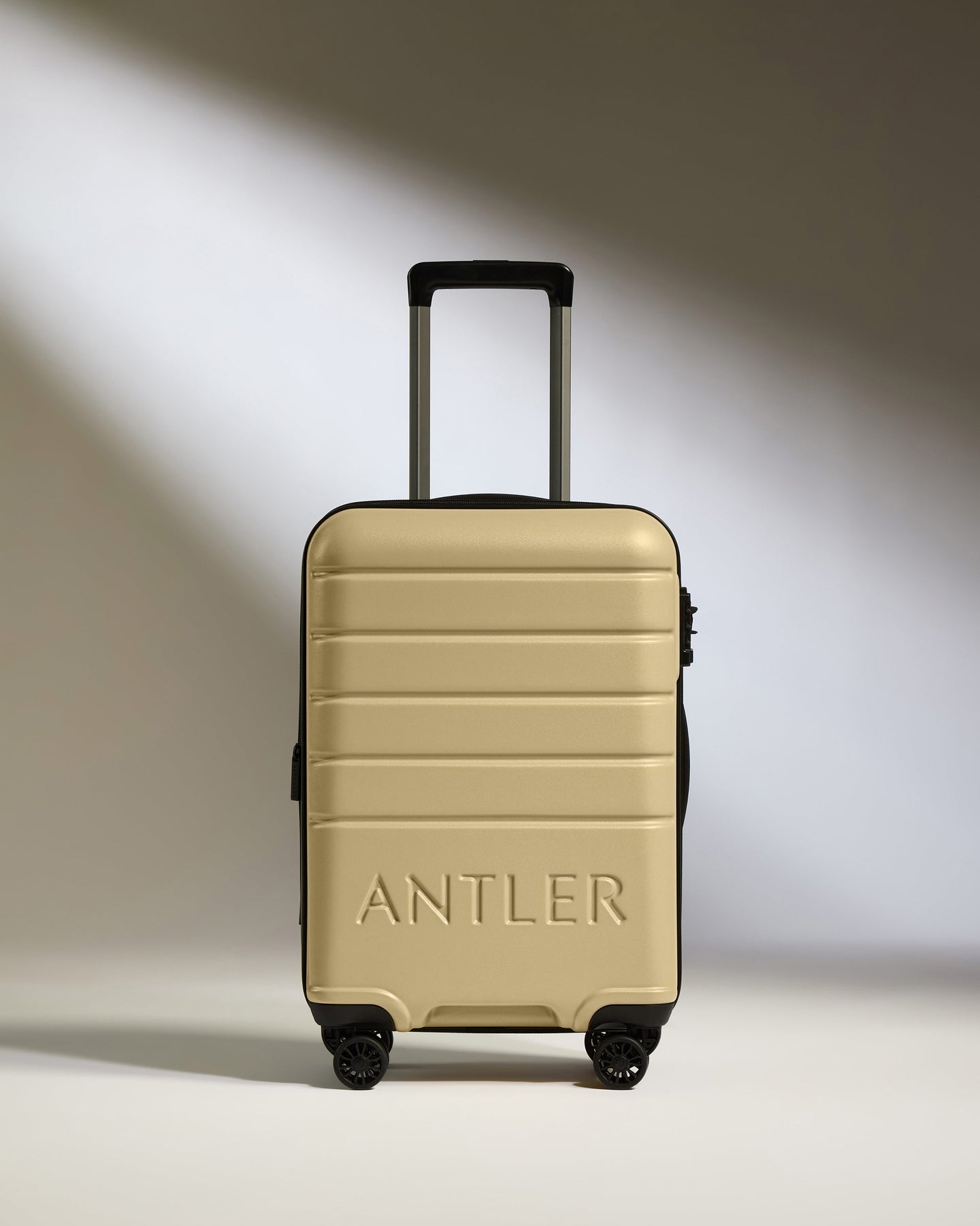 Expandable Cabin Suitcase in Dark Sand - Logo