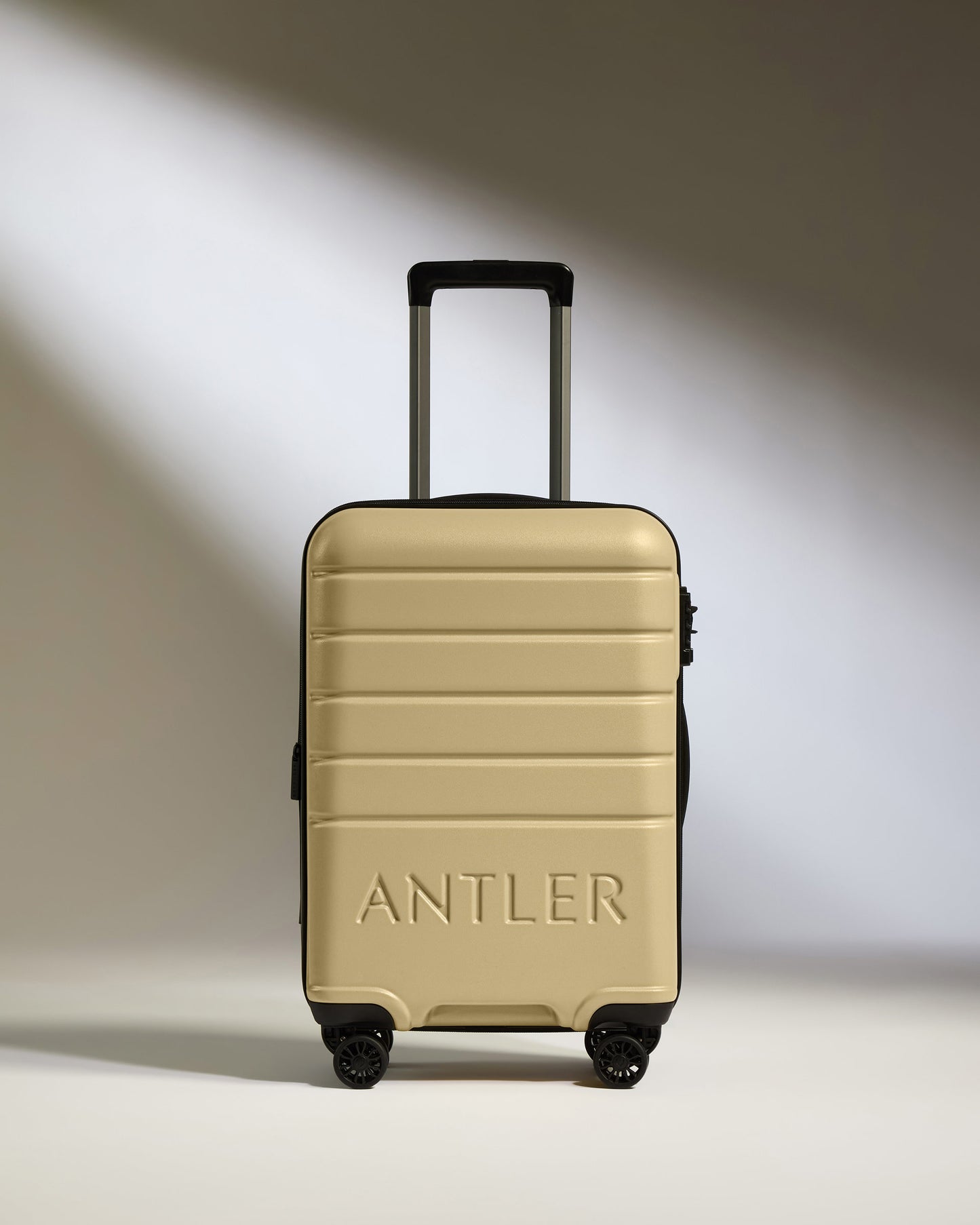 Expandable Cabin Suitcase in Dark Sand - Logo