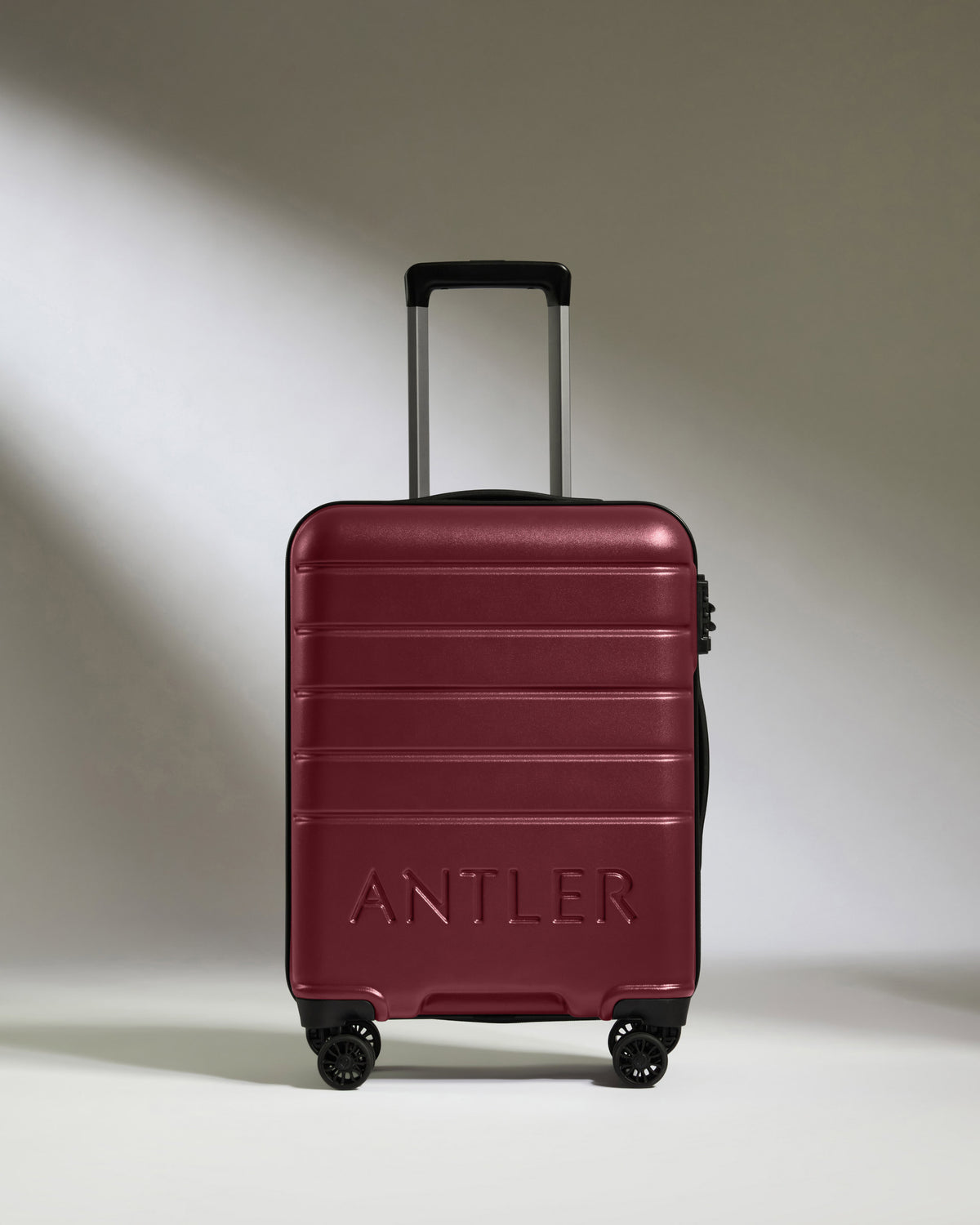 a red suitcase with wheels