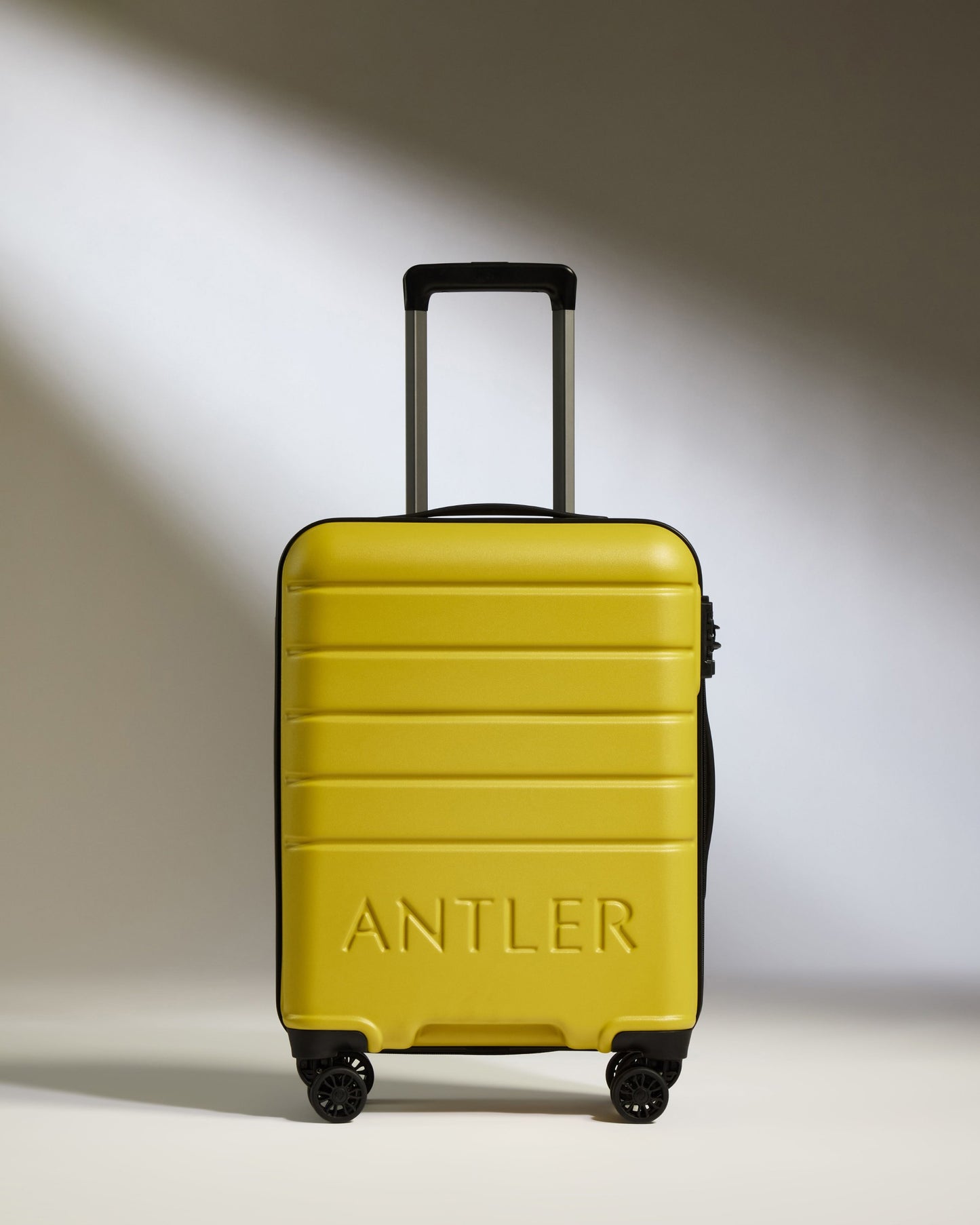 Cabin Suitcase in Mustard Yellow - Logo