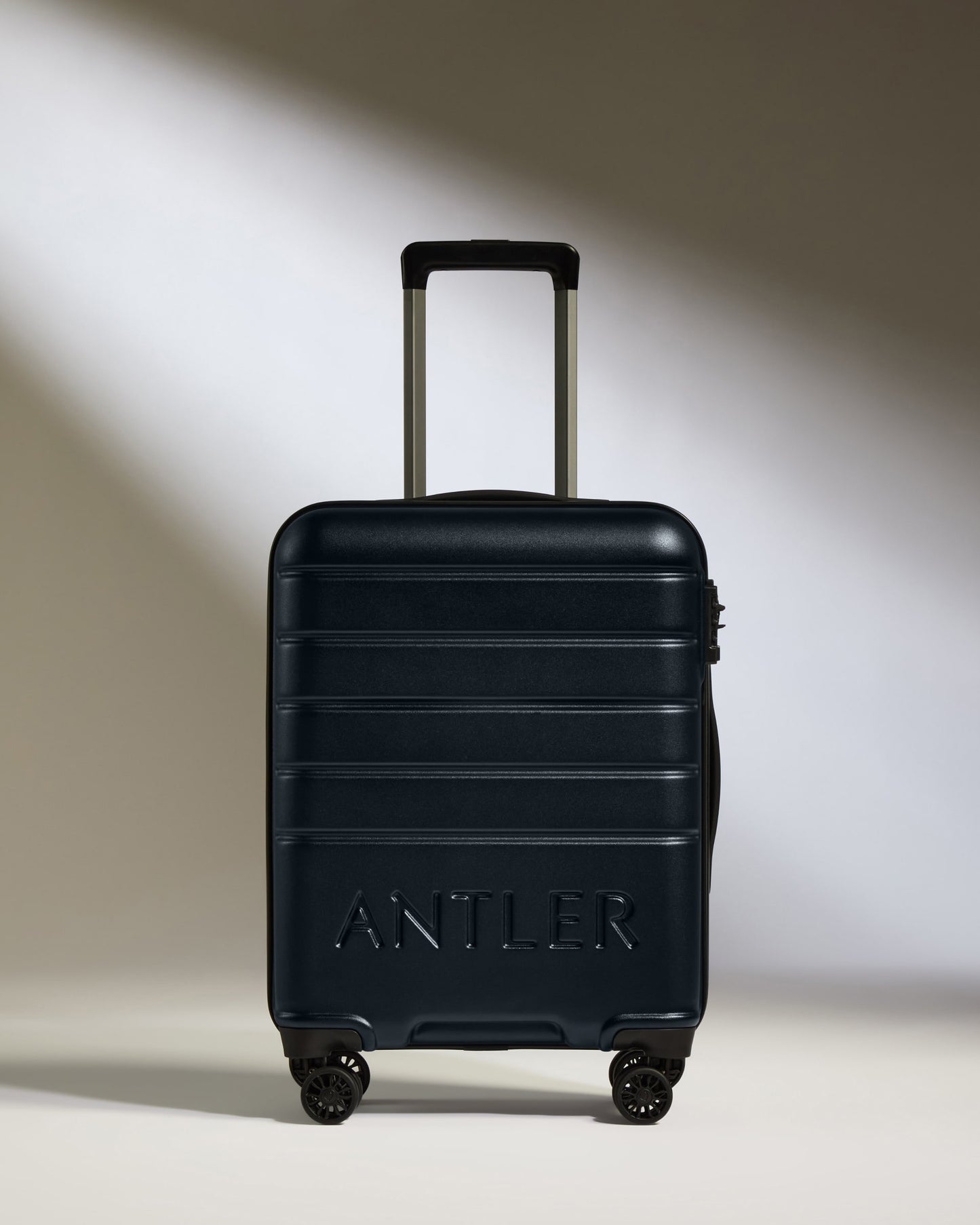 Cabin Suitcase in Dark Navy - Logo